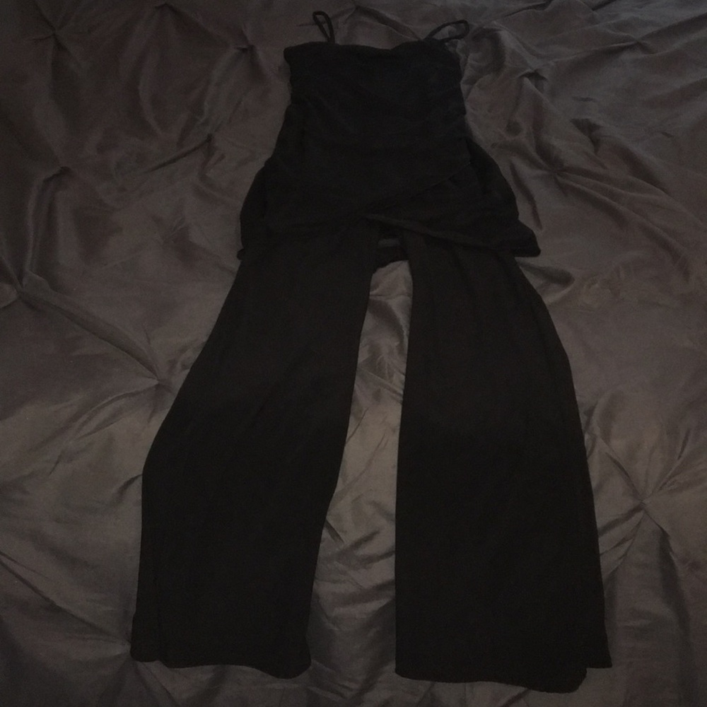 A black fitted one piece with overlay